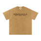 Beige t-shirt with black text on a white background