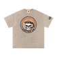 Beige t-shirt with skull and coffee mug graphic on a white background