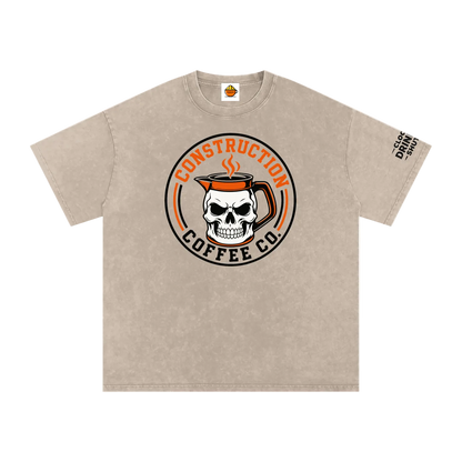 Beige t-shirt with skull and coffee mug graphic on a white background