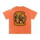 Orange t-shirt with graphic design on a white background