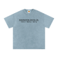 Light blue t-shirt with text on a white background