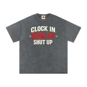 Gray t-shirt with text 'Clock In Drink Up Shut Up' on a white background