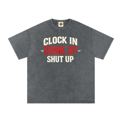 Gray t-shirt with text 'Clock In Drink Up Shut Up' on a white background