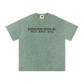 Green t-shirt with text on a white background