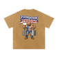 Beige t-shirt with a graphic of a man in chains wearing an American flag shirt and 'Foundation of Freedom' text on a white background.