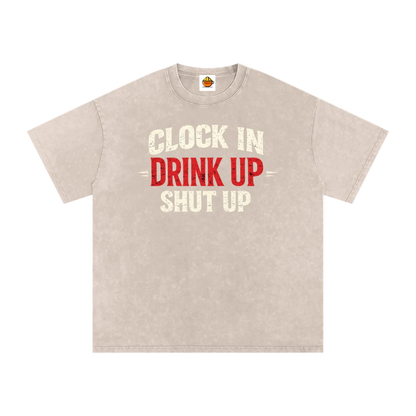 Beige t-shirt with text 'Clock In Drink Up Shut Up' on a white background