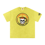 Yellow t-shirt with skull and coffee mug design on a white background