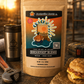Coffee package with a sunset design on a rustic background with a coffee cup and sandwich.