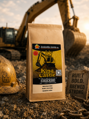 Coffee bag labeled 'King of the Castle' in front of a construction excavator.