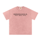 Pink t-shirt with black text on a white background