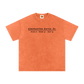 Orange t-shirt with black text on a white background