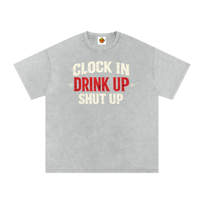 Gray t-shirt with text 'Clock In Drink Up Shut Up' on a white background